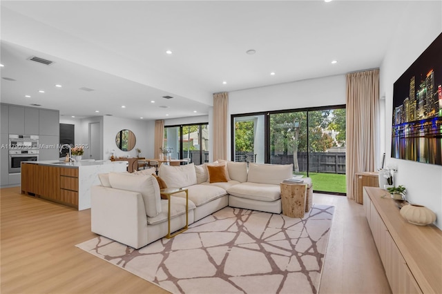 1509 SW 15th St, Miami, FL 33145 - living room with light wood-style floors, recessed lighting, and visible vents