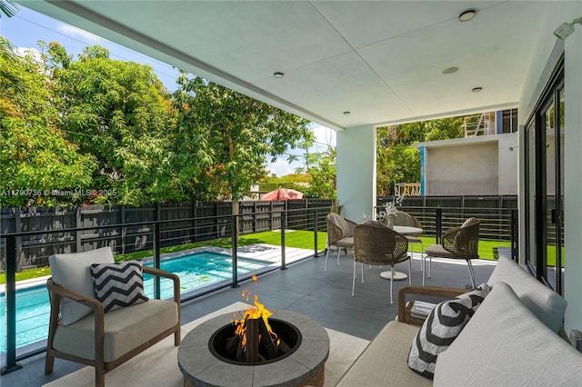 1509 SW 15th St, Miami, FL 33145 - view of patio featuring a fire pit, a fenced backyard, and a fenced in pool