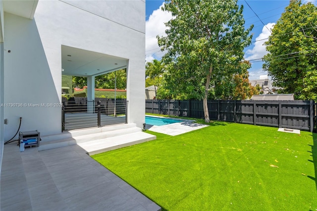 1509 SW 15th St, Miami, FL 33145 - view of yard featuring a fenced in pool, a fenced backyard, and a patio area