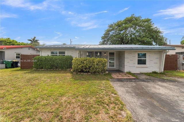 4649 SW 28th Ave, Dania Beach, FL 33312 - view of front of house featuring brick siding and a front lawn