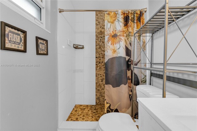 4649 SW 28th Ave, Dania Beach, FL 33312 - bedroom featuring baseboards, ceiling fan, wood finished floors, and visible vents