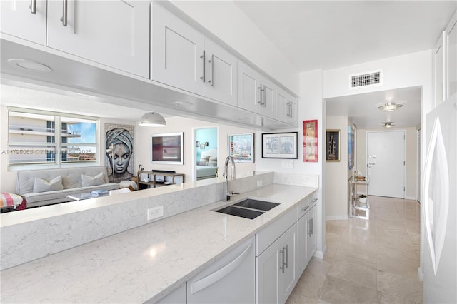650 W Ave Unit 2102, Miami Beach, FL 33139 - kitchen with white appliances, white cabinetry, light stone countertops, and open floor plan