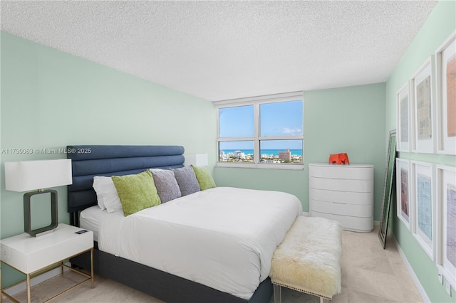 bedroom featuring a textured ceiling