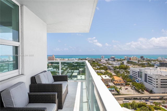 balcony with a view of city and a water view