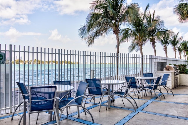 650 W Ave Unit 2102, Miami Beach, FL 33139 - view of patio / terrace with exterior kitchen and a water view