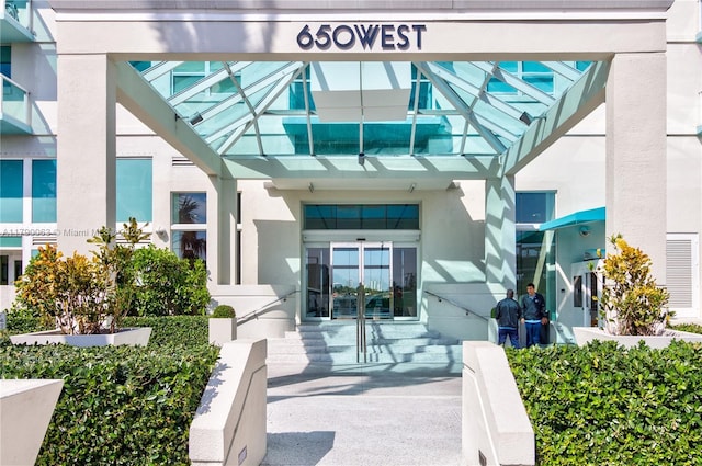 650 W Ave Unit 2102, Miami Beach, FL 33139 - doorway to property with french doors and stucco siding