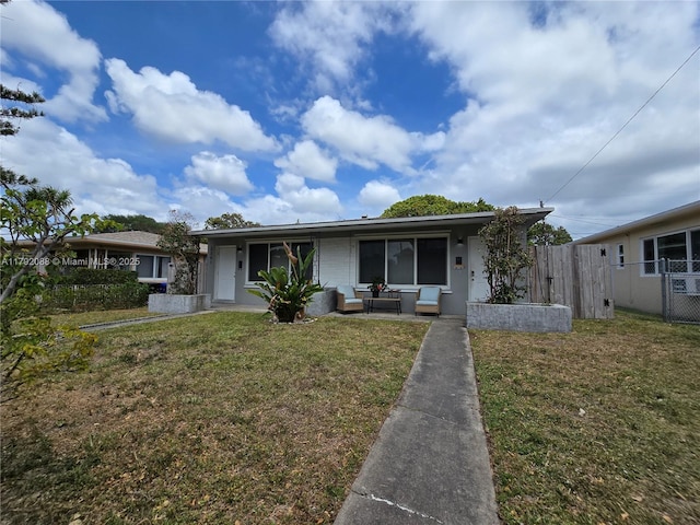 2281 NE 173rd St, North Miami Beach, FL 33160 - bungalow-style home featuring fence, a front yard, and outdoor lounge area