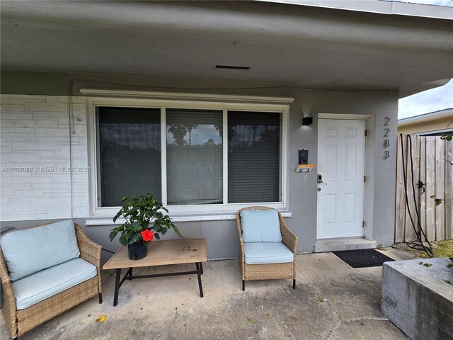 2281 NE 173rd St, North Miami Beach, FL 33160 - property entrance featuring a patio area