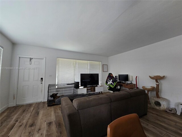 2281 NE 173rd St, North Miami Beach, FL 33160 - living area with wood finished floors and baseboards