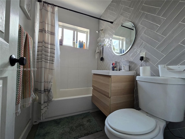 2281 NE 173rd St, North Miami Beach, FL 33160 - full bath with tile walls, shower / bathtub combination with curtain, vanity, tile patterned floors, and toilet