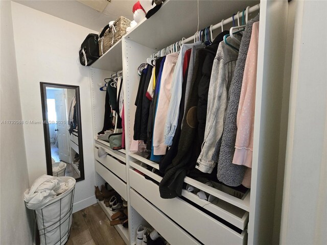 2281 NE 173rd St, North Miami Beach, FL 33160 - spacious closet featuring dark wood-style flooring
