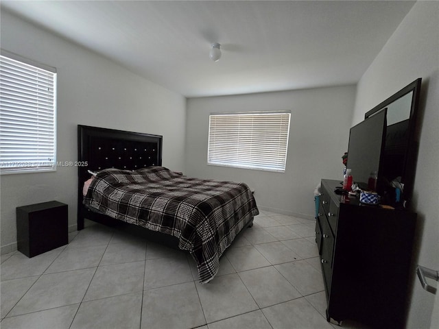 2281 NE 173rd St, North Miami Beach, FL 33160 - bedroom featuring light tile patterned floors and multiple windows