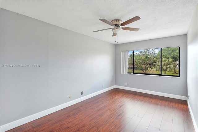5000 S University Dr, Davie, FL 33328 - unfurnished room featuring baseboards, a ceiling fan, a textured ceiling, and dark wood-style flooring