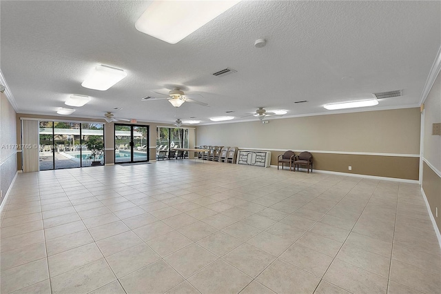 5000 S University Dr, Davie, FL 33328 - spare room with visible vents, a textured ceiling, and crown molding
