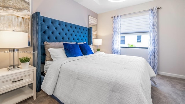 carpeted bedroom with baseboards