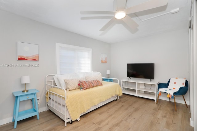 126 Guilford Ct, Tavernier, FL 33070 - bedroom featuring baseboards, ceiling fan, and light wood-style flooring