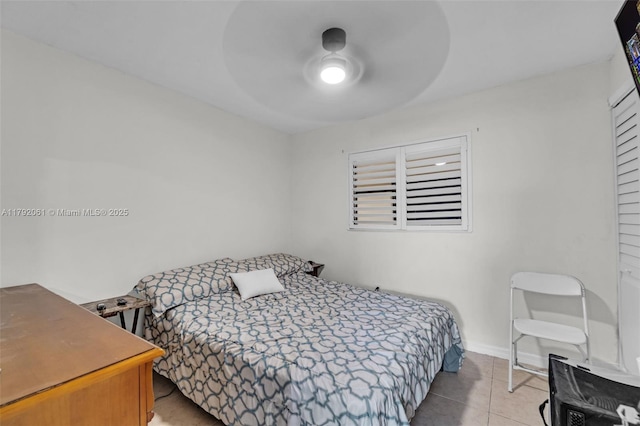 bedroom with light tile patterned floors and ceiling fan