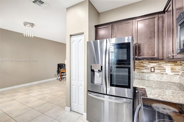 kitchen with tasteful backsplash, visible vents, stainless steel refrigerator with ice dispenser, and dark brown cabinets