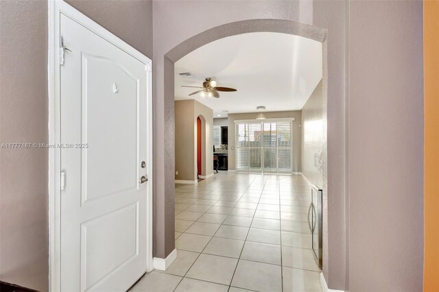 4343 Chalmers Ln, West Palm Beach, FL 33417 - hall with arched walkways and light tile patterned flooring