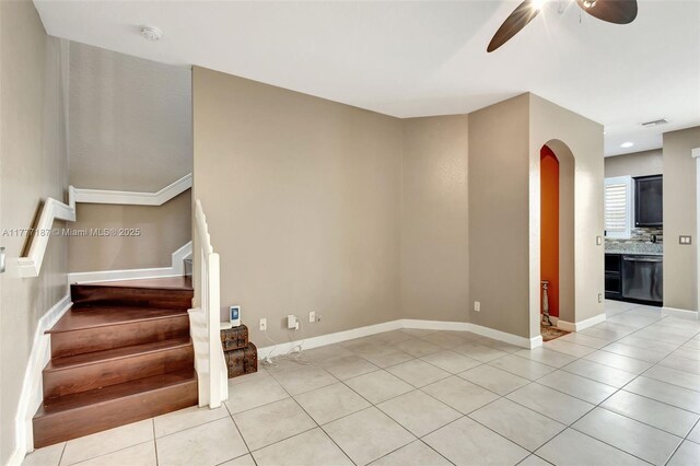 4343 Chalmers Ln, West Palm Beach, FL 33417 - staircase featuring arched walkways, tile patterned floors, and a ceiling fan