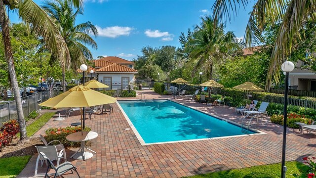 4343 Chalmers Ln, West Palm Beach, FL 33417 - community pool with a patio