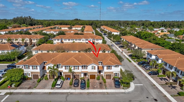 birds eye view of property with a residential view
