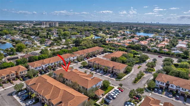 aerial view with a residential view and a water view