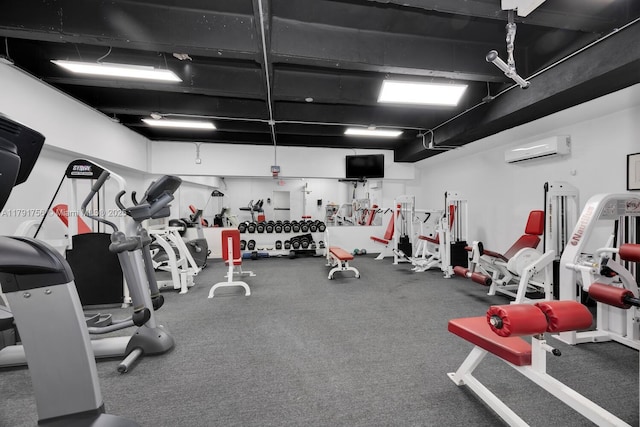 gym featuring a wall mounted air conditioner