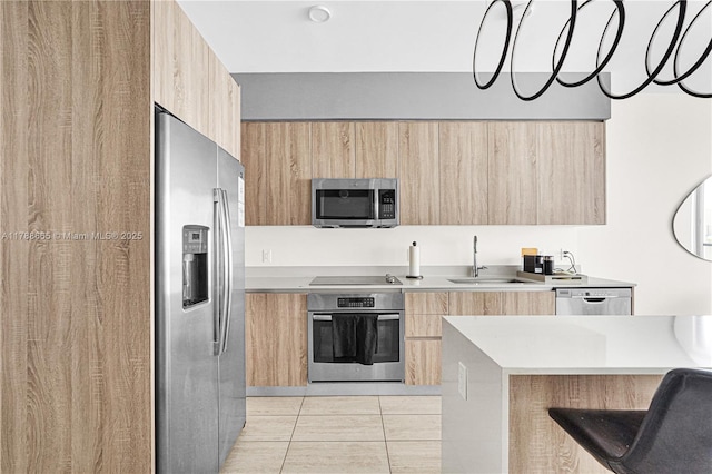 3900 Biscayne Blvd Unit S-920, Miami, FL 33137 - kitchen with light brown cabinetry, appliances with stainless steel finishes, modern cabinets, and a sink
