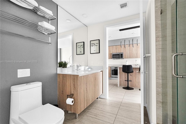 3900 Biscayne Blvd Unit S-920, Miami, FL 33137 - full bathroom with vanity, toilet, a stall shower, and tile patterned flooring