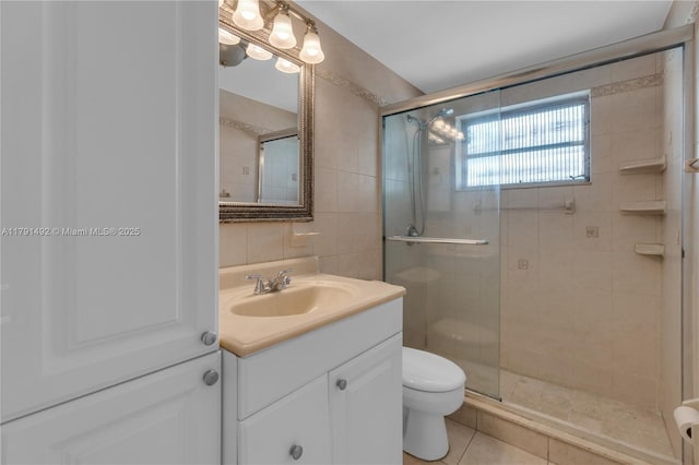 733 NW 30th Ct Unit 1, Wilton Manors, FL 33311 - full bathroom with tile walls, vanity, a stall shower, and tile patterned flooring