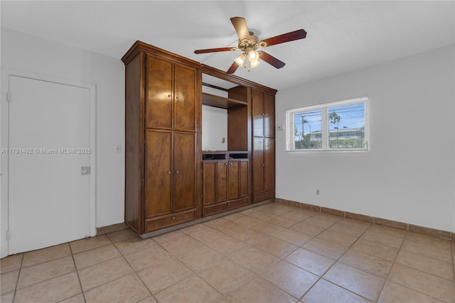 733 NW 30th Ct Unit 1, Wilton Manors, FL 33311 - unfurnished living room featuring ceiling fan and light tile patterned floors