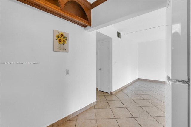 733 NW 30th Ct Unit 1, Wilton Manors, FL 33311 - spare room featuring light tile patterned flooring and baseboards