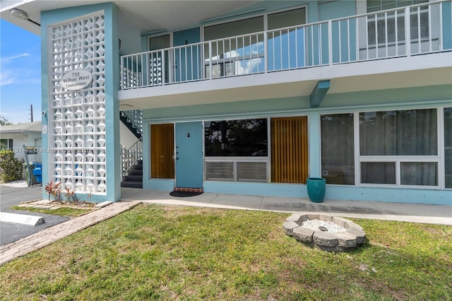 733 NW 30th Ct Unit 1, Wilton Manors, FL 33311 - view of exterior entry with a lawn