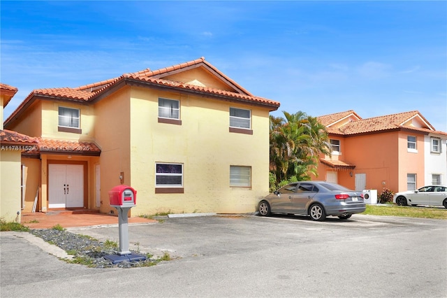 1131 SW 104th Ct, Miami, FL 33174 - exterior space featuring stucco siding, uncovered parking, and a tiled roof