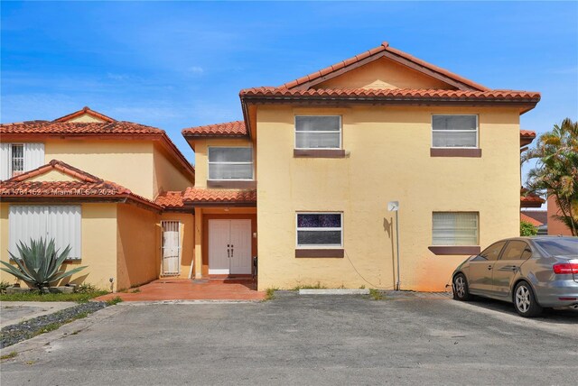 1131 SW 104th Ct, Miami, FL 33174 - view of front of property with stucco siding and a tile roof