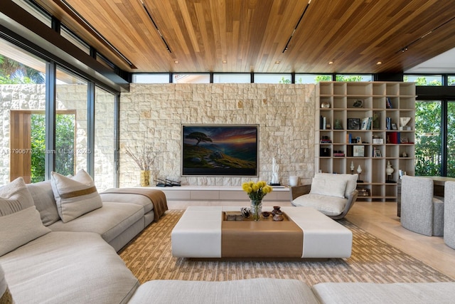 living area with wooden ceiling and expansive windows