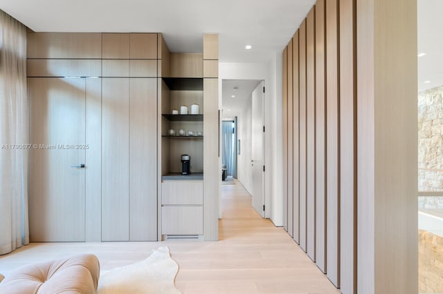 hall featuring recessed lighting and light wood finished floors