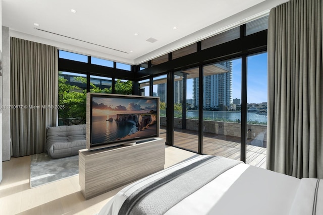 bedroom featuring access to outside and floor to ceiling windows