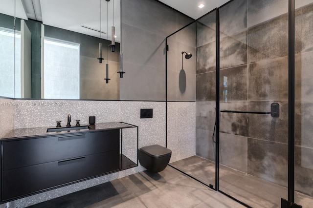 194 S Island Dr, Golden Beach, FL 33160 - full bathroom featuring vanity, toilet, a stall shower, and tile walls