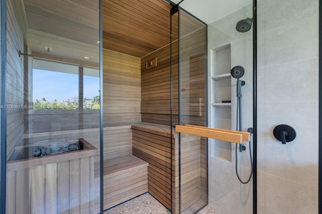 bathroom with wooden ceiling and tiled shower