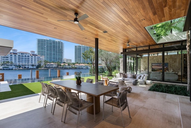 view of patio featuring outdoor dining area and a ceiling fan