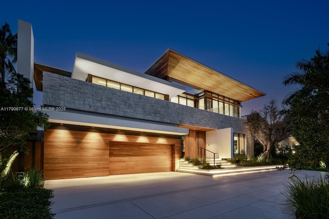 194 S Island Dr, Golden Beach, FL 33160 - modern home with driveway and a garage