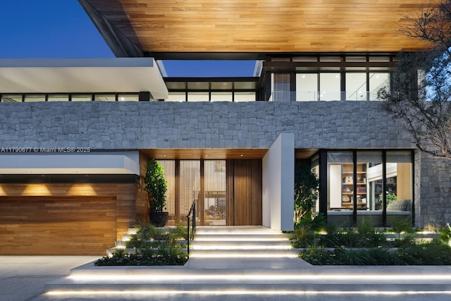 entrance to property featuring a garage