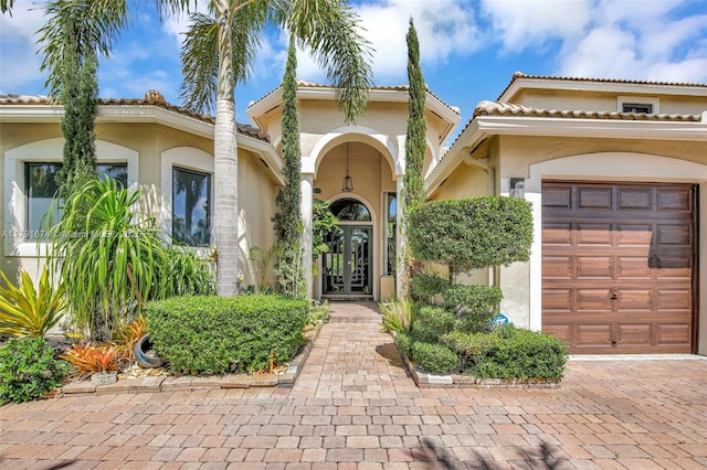 3260 SW 189th Ave, Miramar, FL 33029 - entrance to property with an attached garage, a tile roof, and stucco siding