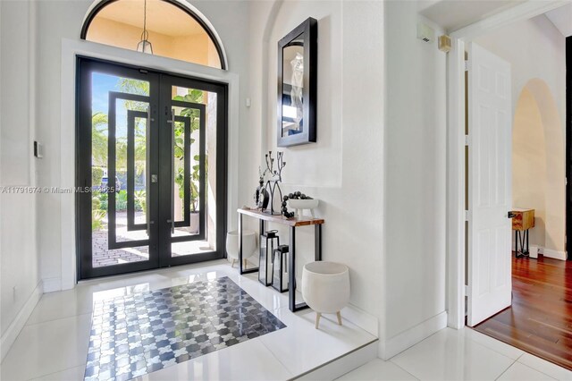 3260 SW 189th Ave, Miramar, FL 33029 - foyer entrance with french doors, baseboards, and tile patterned flooring