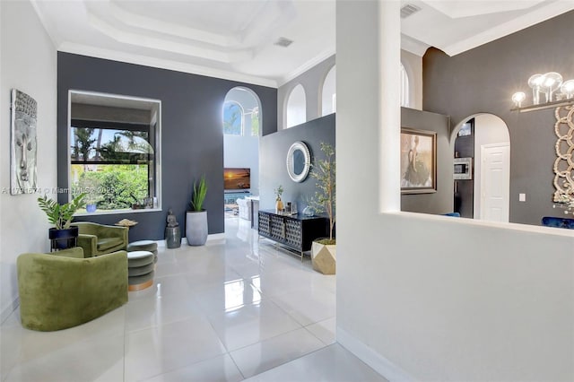 3260 SW 189th Ave, Miramar, FL 33029 - interior space featuring crown molding, a raised ceiling, arched walkways, baseboards, and visible vents