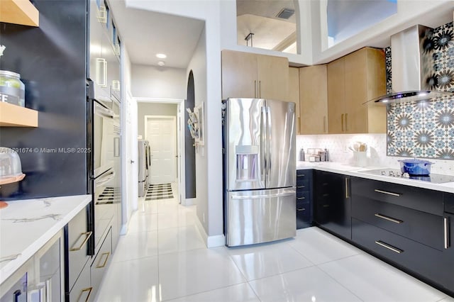 3260 SW 189th Ave, Miramar, FL 33029 - kitchen with light tile patterned flooring, light brown cabinets, wall chimney exhaust hood, appliances with stainless steel finishes, and backsplash