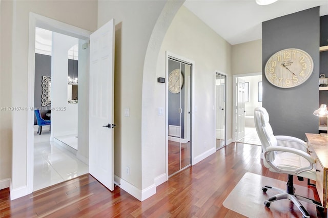 3260 SW 189th Ave, Miramar, FL 33029 - home office with arched walkways, baseboards, visible vents, and wood finished floors
