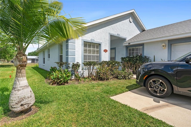 1754 Turtle Rock Dr, Lakeland, FL 33803 - ranch-style home with stucco siding and a front yard